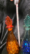 Load image into Gallery viewer, Vintage Hammered Glass Bottle Set Amber & Teal Leaf Stopper Decanters