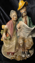 Load image into Gallery viewer, Vintage Napcoware Bisque Porcelain Elderly Couple Bench Figurine – Man Reading Newspaper