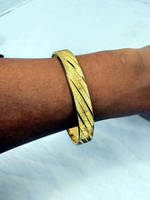 Load image into Gallery viewer, Vintage Monet Gold Tone Textured Diagonal Stripe Bangle Bracelet 7.5-8 Inch