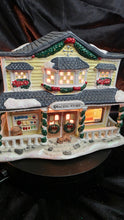 Load image into Gallery viewer, Snowflake Falls “General Store” Illuminated Porcelain Holiday House – Lighted Village Collectible