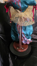 Load image into Gallery viewer, Vintage Gold Deer & Co. Ltd. Porcelain Display Doll – Teal & Crimson Ensemble with Golden Headdress