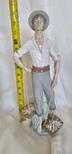Load image into Gallery viewer, Lladro Porcelain Fisherman Figurine - Exquisite Vintage Collectible Treasure
