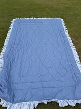 Cargar imagen en el visor de la galería, blue quilt with a floral pattern and ruffled edges  Size 63”x 96”
