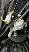 Load image into Gallery viewer, Vintage-Style Textured Gray Elephant Figurine with Raised Trunk &amp; Gold Accents

