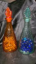 Load image into Gallery viewer, Vintage Hammered Glass Bottle Set Amber &amp; Teal Leaf Stopper Decanters
