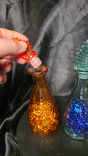 Load image into Gallery viewer, Vintage Hammered Glass Bottle Set Amber &amp; Teal Leaf Stopper Decanters
