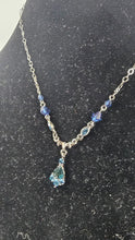 Charger l'image dans la galerie, 1928 Jewelry Blue Crystal Drop Necklace with Silver-Tone Chain and Faceted Accents

