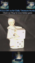 Load and play video in Gallery viewer, Vintage Monti Piero Porcelain Harlequin Clown Figurine with Dice – White &amp; Gold Elegance
