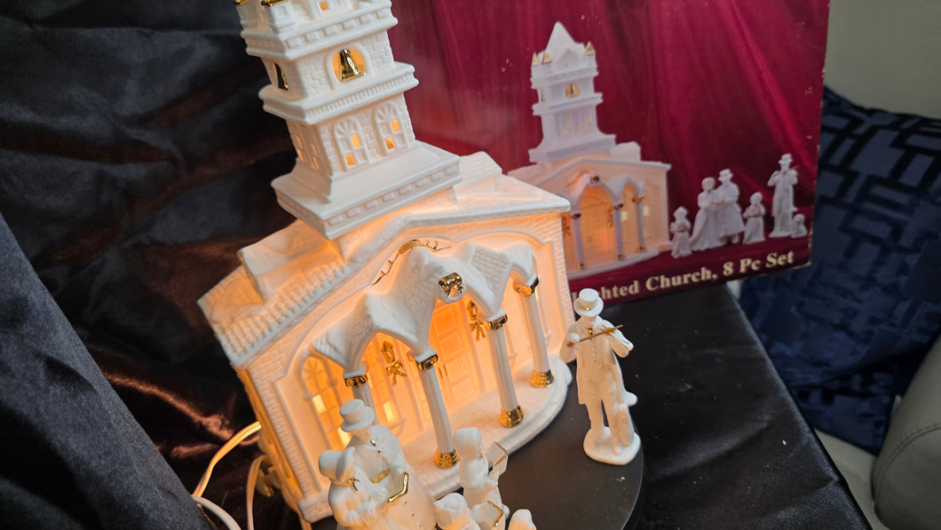 Porcelain Illuminated “Christmas Church & Caroler” 8-Piece Lighted Holiday Village Set – White & Gold Accents