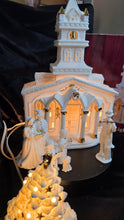 Load image into Gallery viewer, Porcelain Illuminated “Christmas Church &amp; Caroler” 8-Piece Lighted Holiday Village Set – White &amp; Gold Accents

